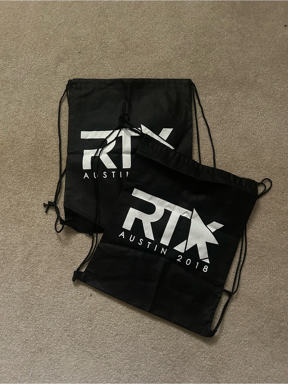 Two Rooster Teeth RTX drawstring bags